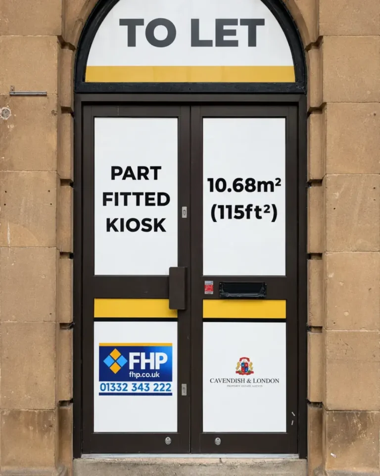 The vacant part-fitted kiosk at The Royal Buildings, Derby: arched doorway with To Let signage showing 10.68 square metres (115 sq ft)